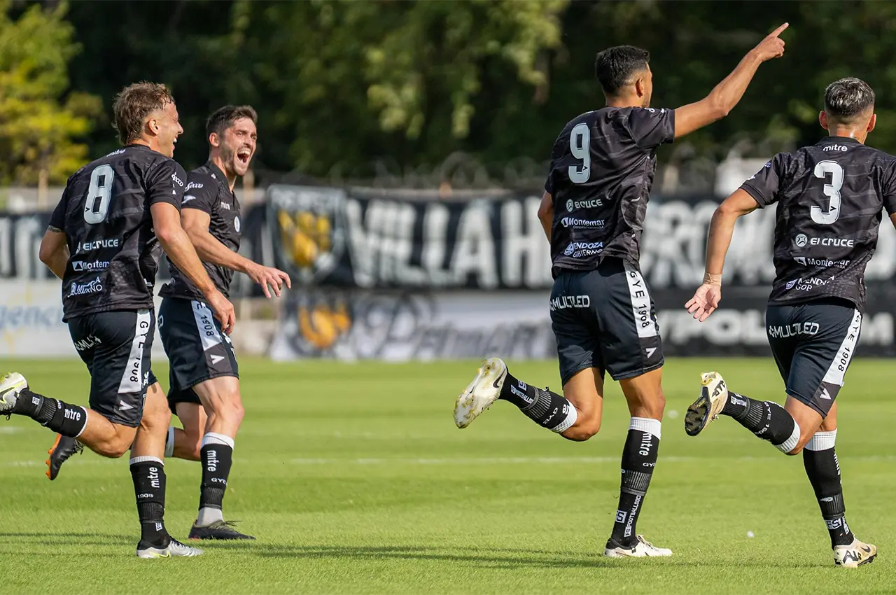 men running on a soccer field